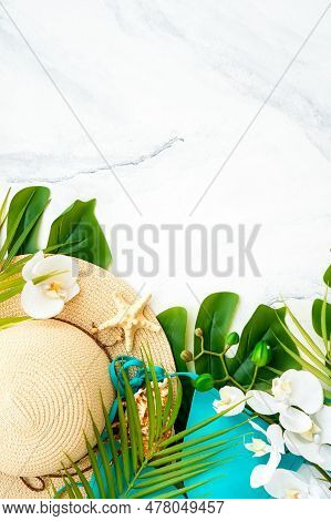 Summer Holidays And Travel Concept. Palm Leaves, Hat And Tripical Flowers On White Background. Flat 