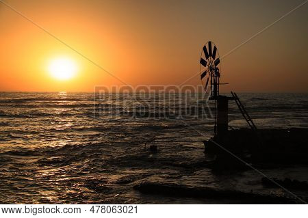 Windmill For Extracting Sea Water For Saltmarshes In The Coastal City Of Anfeh, Lebanon.