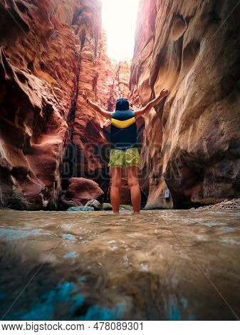 Tourists In Wadi Mujib Is A Gorge In Jordan Which Enters The Dead Sea At 410 Meters Below Sea Level.
