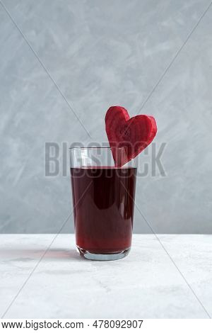 Healthy Drink With Beetroot Juice. Glass Of Red Beverage Decorated Slice Of Beet Heart Shaped. Salga