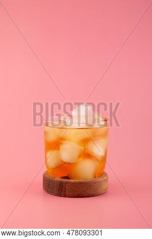 Glass Of Apple Spritzer Or Apfelschorle On Pink Background. Cold Carbonated Apple Juice. Homemade Sp