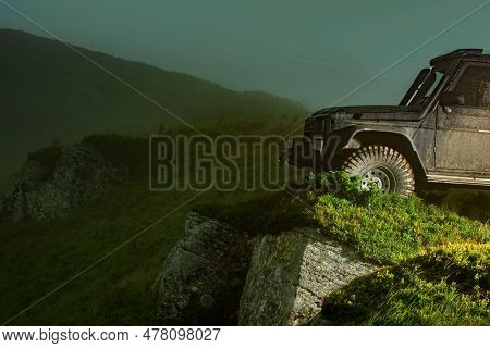 Off-road Vehicle Stuck On Impenetrable Road After Rain In The Countryside. Offroad Travel On Mountai