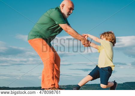 Grandfather Helping Hand. Child Rearing. The Educative Process Needs To Begin Early In A Childs Life