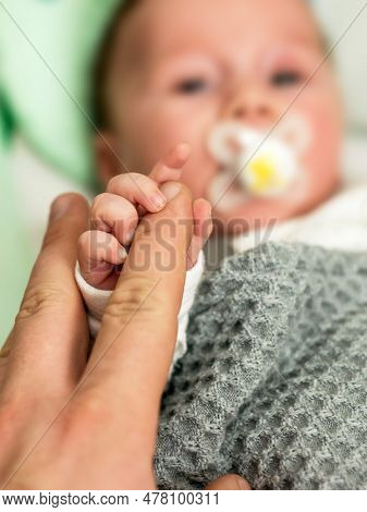 Sweet Tiny New Born Baby Hand Hold Mum Index Finger. Concept Relationship Between Mother Or Parants 