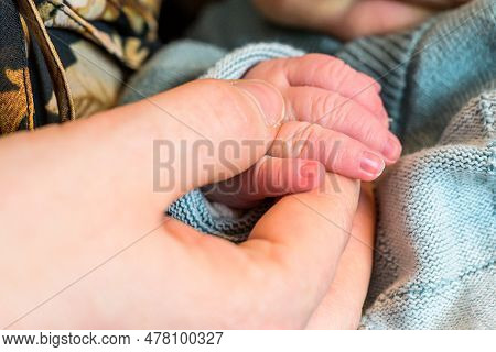 Sweet Tiny New Born Baby Hand Hold Mum Index Finger. Concept Relationship Between Mother Or Parants 