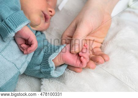 Sweet Tiny New Born Baby Hand Hold Mum Index Finger. Concept Relationship Between Mother Or Parants 