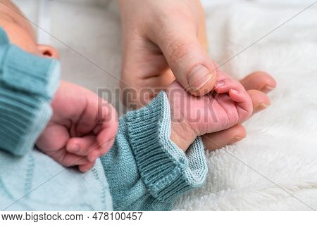 Sweet Tiny New Born Baby Hand Hold Mum Index Finger. Concept Relationship Between Mother Or Parants 
