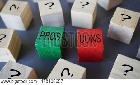 Selective Focus Image Of Wooden Blocks With Question Mark, Text Pros And Cons.
