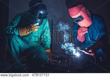 Metal Welding Steel Works Using Electric Arc Welding Machine To Weld Steel At Factory. Metalwork Man