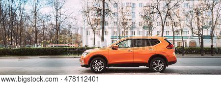 Gomel, Belarus - April 16, 2019: Orange Nissan X-trail Third Generation Car Parked At Street. Side V