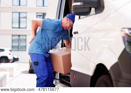 Lifting Box Backpain. Mover With Heavy Boxes