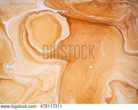 Abstract Background Of Brown Emulsion Paint. Waves, Wavy Lines, Ragged Structure. Paint Brush, Worn.