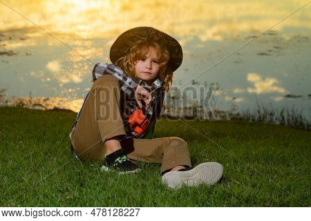 Scout Boy Wearing Explorer Hat And Backpack Outdoor. Explorer And Adventure With Binocular.