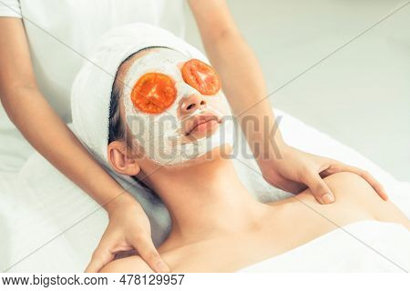 Beautiful Woman Having A Facial Mask Treatment With Tomato Cream Extract Showing Benefit Of Nature T