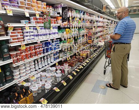 Wilmington, Delaware, U.s.a - May 30, 2023 - A Man Shopping For Varieties Of Yogurt And Cheese Brand