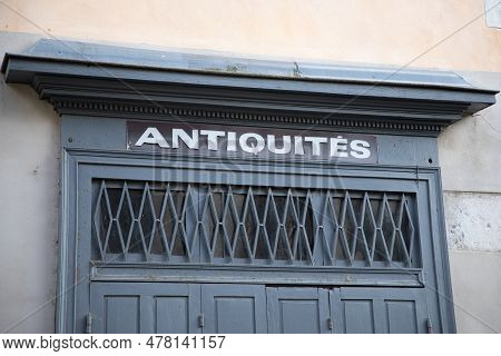 Antiquites Facade Wall Entrance In City Street With France Text Antiques In French Antiquites Transl