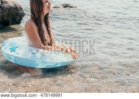 Woman Summer Sea. Happy Woman Swimming With Inflatable Donut On The Beach In Summer Sunny Day, Surro