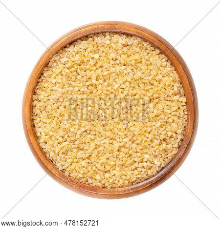 Coarse Bulgur, Also Called Burghul, In A Wooden Bowl. Cracked And Parboiled Wheat Foodstuff, And A C