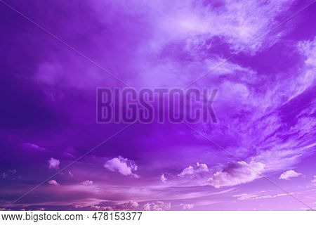 Sky And Fluffy Clouds, Bright Cloudscape Background. Bright Dramatic Cloud Sky In Magenta Colours. A