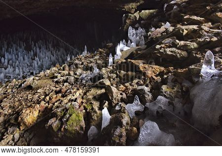 Russia. Kuril Islands. Cave With Numerous Ice Stalagmites On The Island Of Iturup. During The Time O