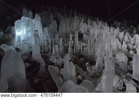 Russia. Kuril Islands. Cave With Numerous Ice Stalagmites On The Island Of Iturup. During The Time O