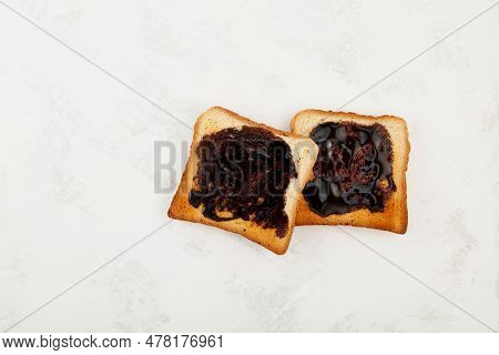 Two Hot Toasts For Breakfast, Top View. Roasted Aussie Savory Toasts With Vegemite Spread. Vegemite 