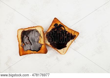 Two Roasted Aussie Savoury Toasts With Vegemite Spread, Top View. Vegemite Is A Very Popular Yeast B