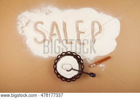 Salep Flour Or Orchis Mascula Powder On Brown Background. Inscription Salep, Also Spelled Sahlep Or 