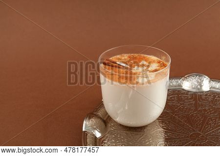 Salep Or Sahlep In Glass On Brown Background. Selective Focus, Copy Space. Salep - Turkish Instantly