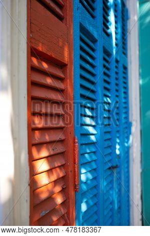 Beautiful Bright Colorful And Authentic Red And Blue Shutters Of Ancient Houses