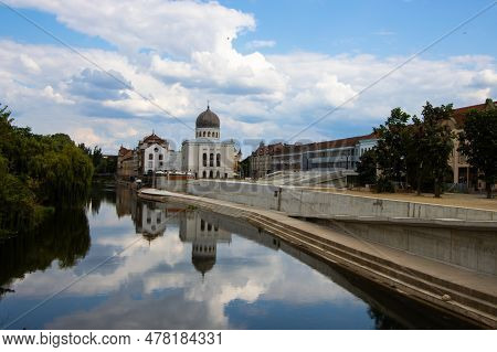 Oradea, Romania, July, 23, 2021, Neolog Synagogue Sion Reflected In Crisu Repede River