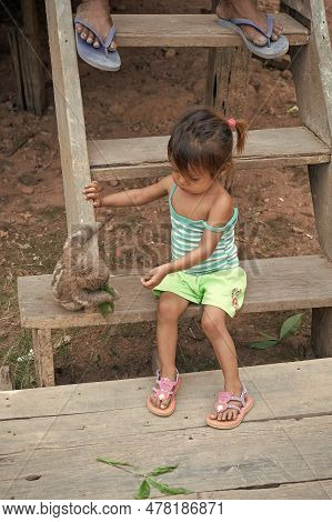 Boca De Valeria, Amazon River Brazil - December 03, 2015: Poor Kid Girl Play With Sloth Animal