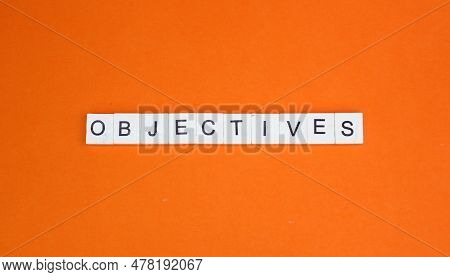 Letters Of The Alphabet With Objective Words. Objective Business Concept. A Thing Aimed At Or Sought