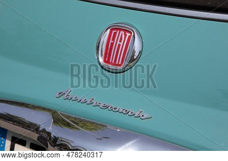 Milano , Italia - 06 21 2023 : Fiat 500 Blue Neoretro Anniversario Limited Edition  Logo Brand And T