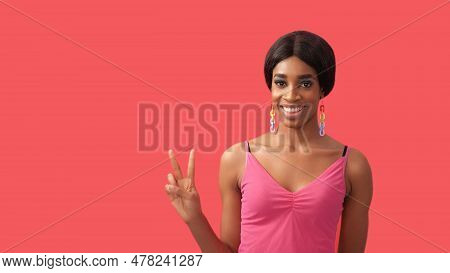 Peace Gesture. V Sign. Friendly Expression. Cheerful Smiling Woman Showing Two Fingers Isolated On P