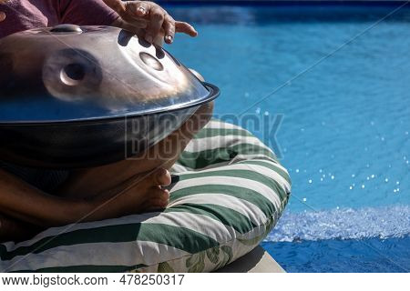 Man Playing A Percussion Instrument. Musical Instrument.