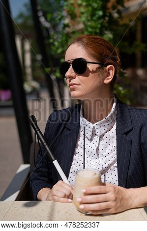 Blind Woman In Business Suit Drinking Ice Coffee In Outdoor Cafe.