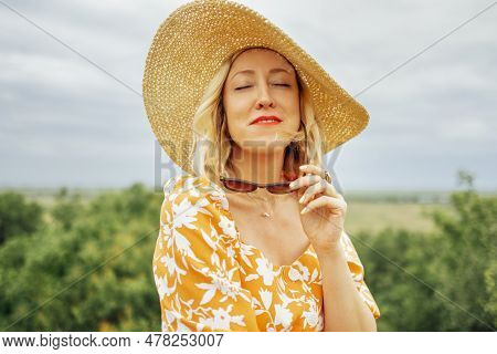 Close Up Of Female Portrait Of Attactive Blonde Girl Closed Her Eyes And Enjoys Moment. Young Woman 