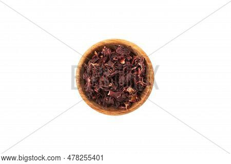Dried Hibiscus Petals Or Hibiscus Sabdariffa In Wooden Bowl, Top View. Karkade Petals Used To Make H