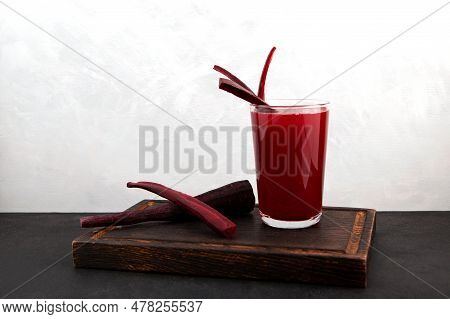 Glass Of Salgam On Wooden Cutting Board. Popular Turkish Drink. Traditional Beverage Made With Water