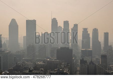 Montreal, Ca - 24 June 2023: Montreal Downtown In The Smoke Of Canadian Forest Fires