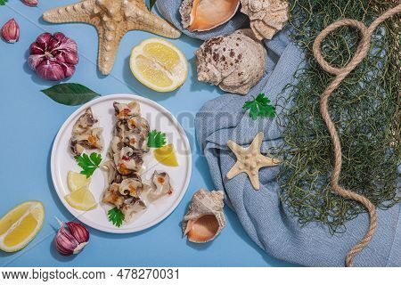 Pickled Rapan Meat With Oil, Spices And Greens. Healthy Seafood Rich Of Omega