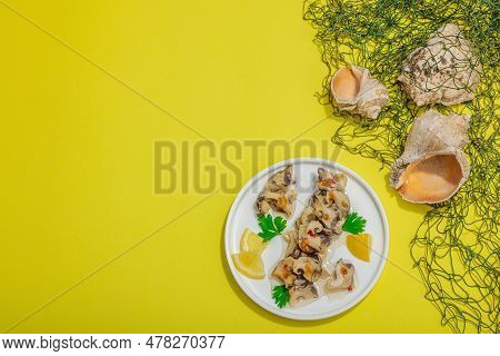 Pickled Rapan Meat With Oil, Spices And Greens. Healthy Seafood Rich Of Omega