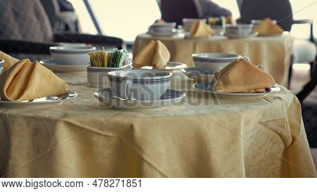 Table Served With Tablecloth And Tablewear. Served Table In Restaurant. Cafe Table