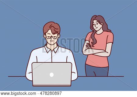 Frustrated Woman Near Husband Using Laptop And Suffering From Internet Addiction And Working Late In