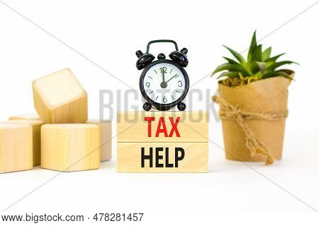 Tax Help Symbol. Concept Words Tax Help On Wooden Blocks On A Beautiful White Table White Background