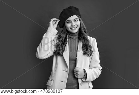Parisian Teen Girl Isolated On Red Background. Parisian Teen Girl In Studio. Young Parisian Girl.