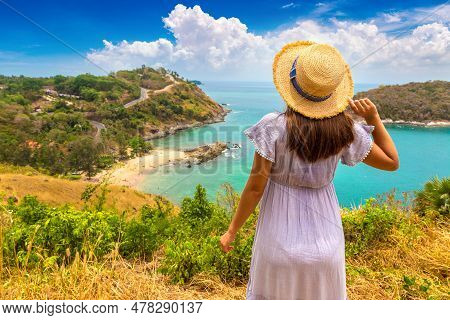 Woman Traveler Wearing Blue Dress And Straw Hat At   Panoramic View Of  Yanui Beach At Phuket In Tha