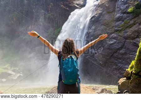 Woman Tourist And Dunhinda Waterfall In A Sunny Day In Sri Lanka