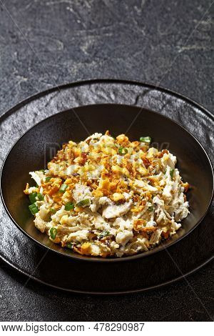 Close-up Of Chicken Rice Casserole D Iberville Topped With French Fried Onion And Crumbled Crackers 